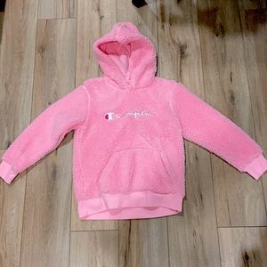 very fuzzy bright pink champion sweatshirt. Girls large (12-14)